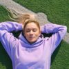 Peaceful woman lying on stadium